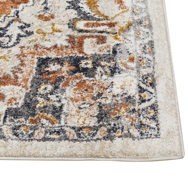 Nahaufnahme eines mehrfarbigen Teppichs mit orientalischem Muster im Vintage-Stil und gekettelter Kante.