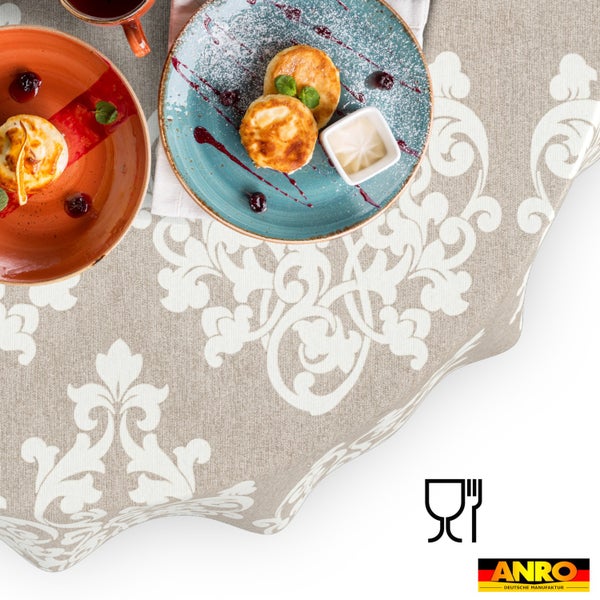 Abwaschbare Tischdecke mit barockem Ornamentmuster, lebensmittelecht. ANRO Logo.