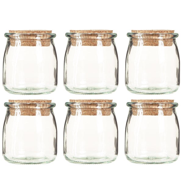 Sechs kleine Gläser mit Korkdeckel.