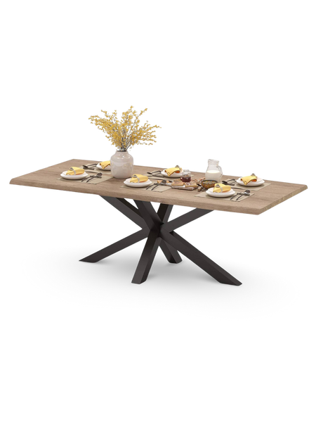 Esstisch mit Tischplatte in Holzoptik und schwarzem sternförmigem Metallgestell, gedeckt mit Geschirr und Vase.