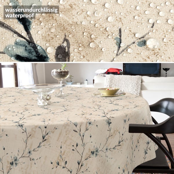 Runde Tischdecke mit floralem Muster und wasserabweisender Oberfläche.