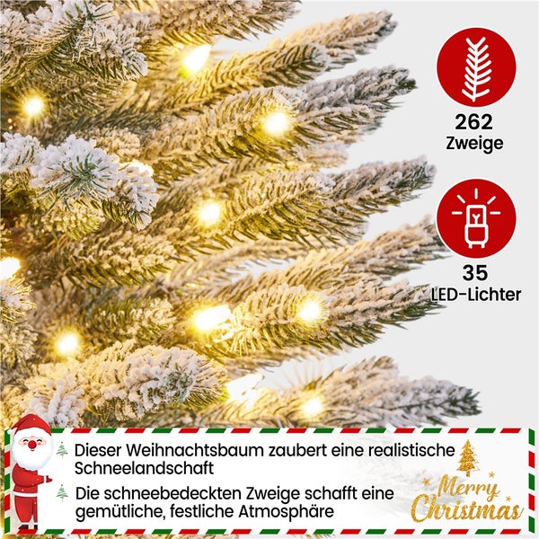 Nahaufnahme eines beschneiten, künstlichen Weihnachtsbaums mit 262 Zweigen und 35 LED Lichtern.