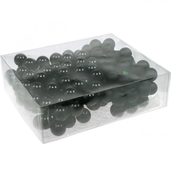 Dekorative Trauben aus Kunststoff im transparenten Behälter