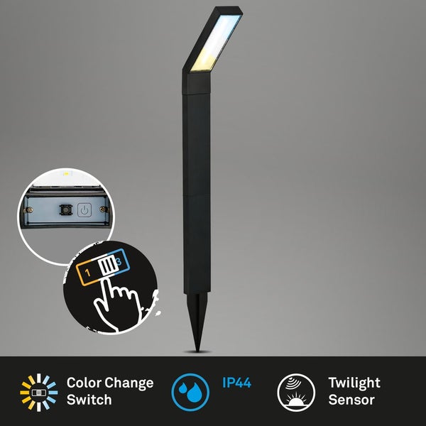 Schwarze LED-Gartenleuchte mit Erdspieß, Schalter für Farbtemperaturwechsel, Schutzart IP44 und Dämmerungssensor.