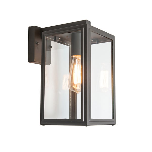 Rechteckige Außenwandleuchte aus Metall und Glas mit sichtbarem Leuchtmittel in Filamentoptik.