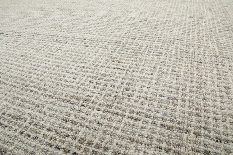 Strukturierter Teppich mit gewebtem Gittermuster.