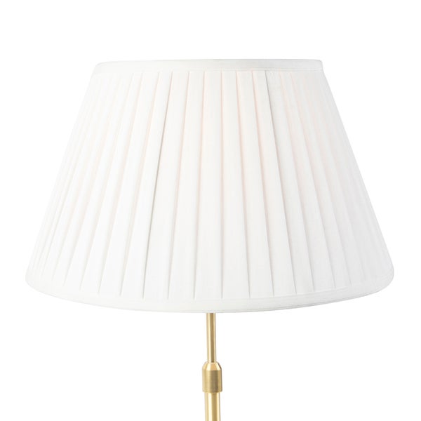 Plissierter Stoff-Lampenschirm in konischer Form auf einem messingfarbenen Lampengestell.
