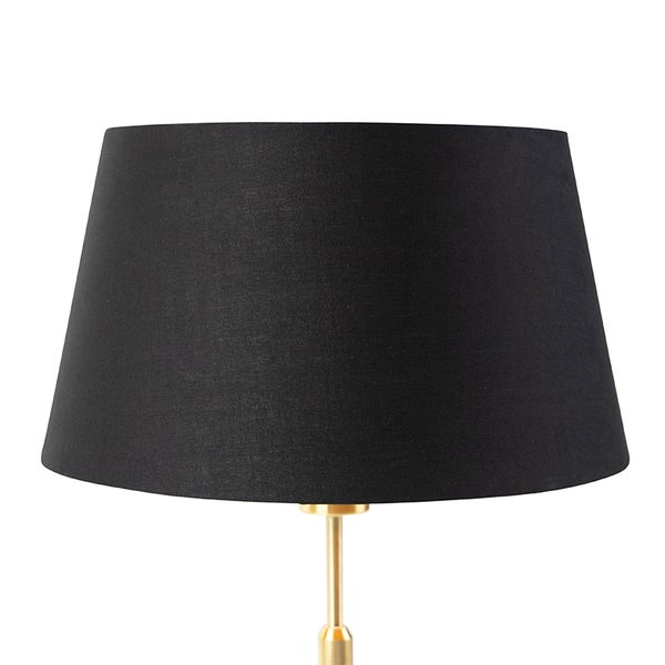 Konischer Lampenschirm aus schwarzem Stoff auf einem goldfarbenen Metallstiel.