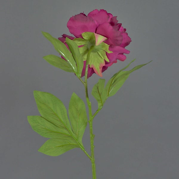 Künstliche Pfingstrose mit dunkelrosa Blütenblättern und gelber Mitte.