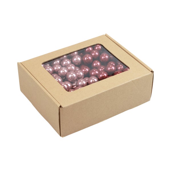 Dekokugeln in einer Pappschachtel mit Sichtfenster
