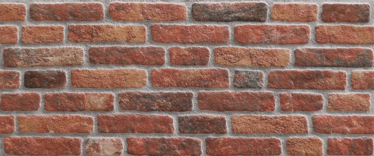 Nahaufnahme einer Wand mit roten Backsteinen