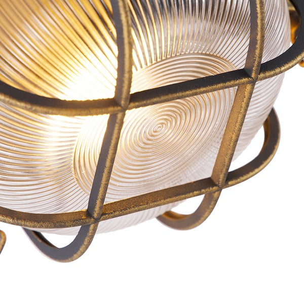 Nahaufnahme einer Wand- oder Deckenleuchte mit geriffeltem Glas und schützendem Metallgitter im industriellen Design.