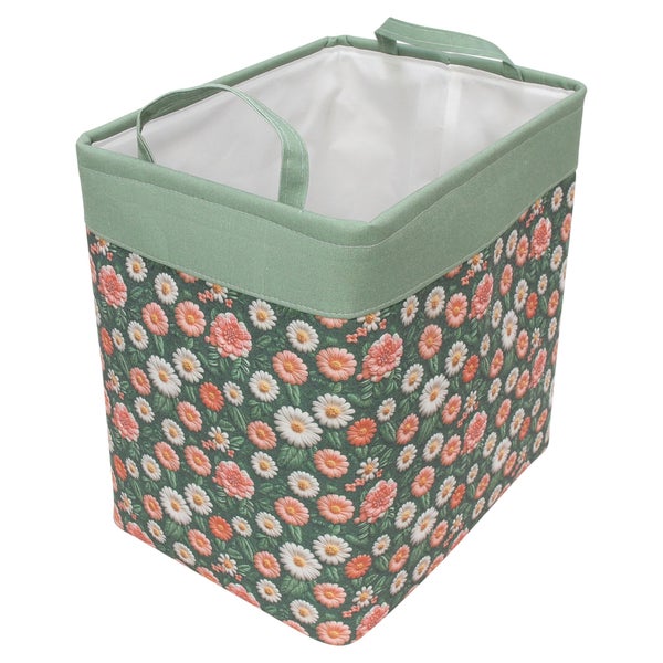 Grüner Aufbewahrungskorb aus Stoff mit Blumenmuster und zwei Tragegriffen.