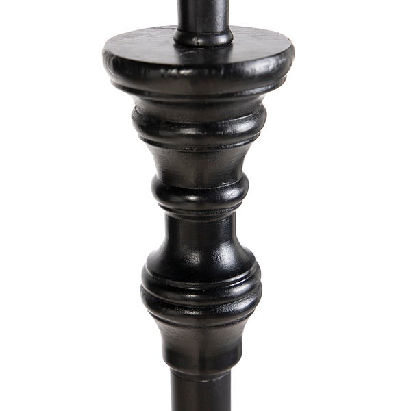 Detail eines schwarzen dekorativen Pfostens mit gedrechselter Form und matter Oberfläche.