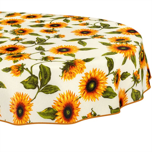 Runde Tischdecke mit Sonnenblumen-Motiv und eingefasstem Rand.