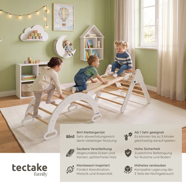 Drei Kinder spielen in einem hellen Kinderzimmer auf einem achteinhalb Klettergerüst aus Holz von tectake family mit Rutschbrett und Kletterbogen.