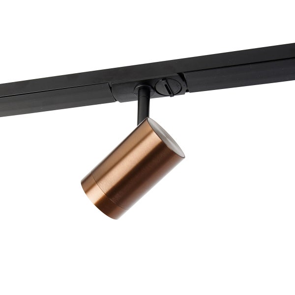 Zylinderförmiger Schienenstrahler in Bronze an einer schwarzen Stromschiene.