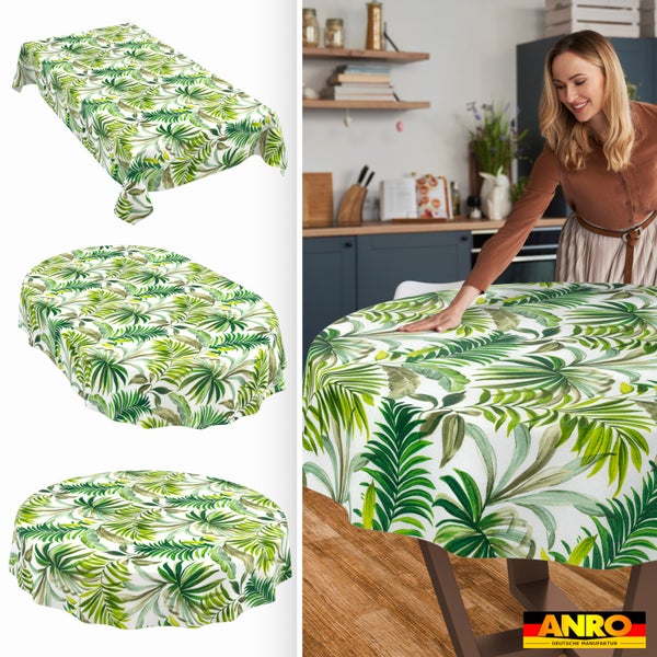 Abwaschbare Tischdecke mit grünem tropischem Blättermotiv, erhältlich in rechteckig, oval und rund, präsentiert in einer Küche. ANRO Logo.