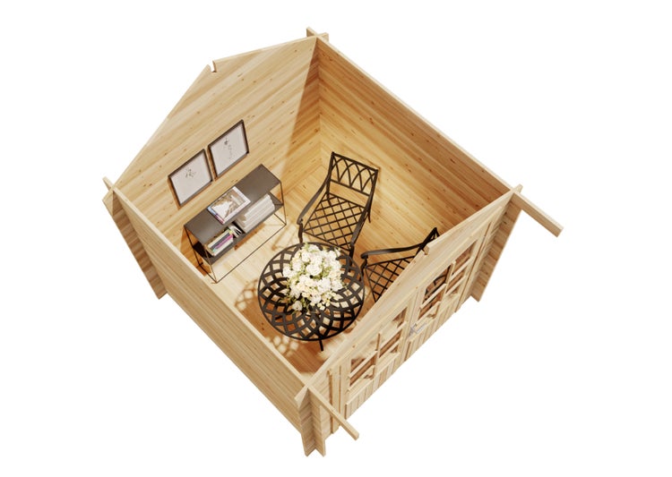 Draufsicht in ein helles Gartenhaus aus Holz mit einer schwarzen Metallsitzgruppe, einem Konsolentisch und Wandbildern.