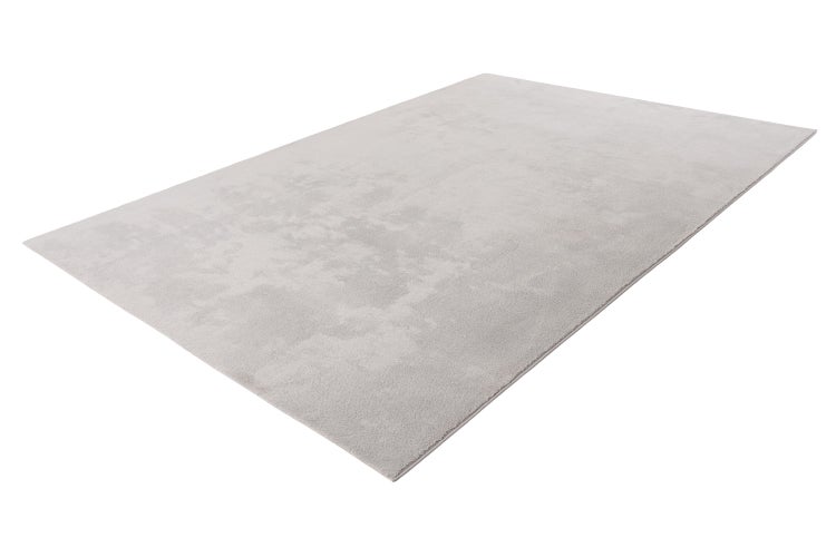 Rechteckiger Teppich in unifarbenem Design aus weichem Material.