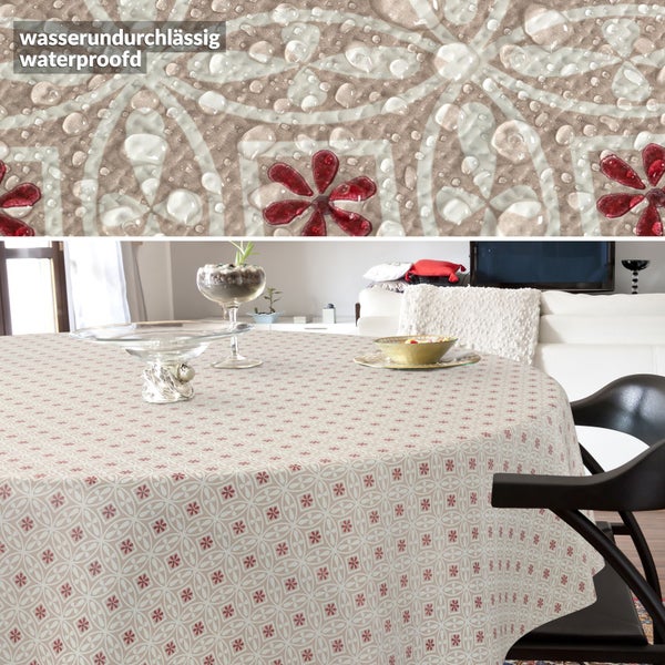 Runde Tischdecke mit geprägtem geometrischem Blumenmuster auf einem Küchentisch, Detailaufnahme der Textur und ANRO Logo.