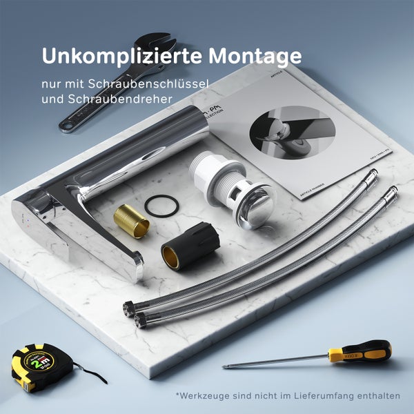 Waschtischarmatur Set mit Montageanleitung und Anschlussschläuchen auf einer Marmorplatte präsentiert für eine einfache Installation.