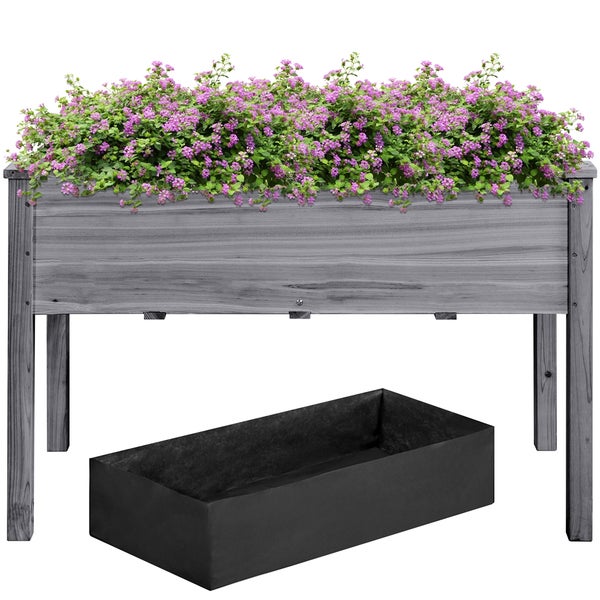 Hochbeet aus Holz mit Pflanzen und Pflanzbehälter