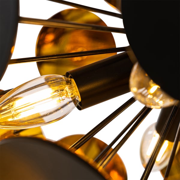 Detailaufnahme einer Hängeleuchte mit Leuchtmitteln, Dekorationsscheiben und Streben