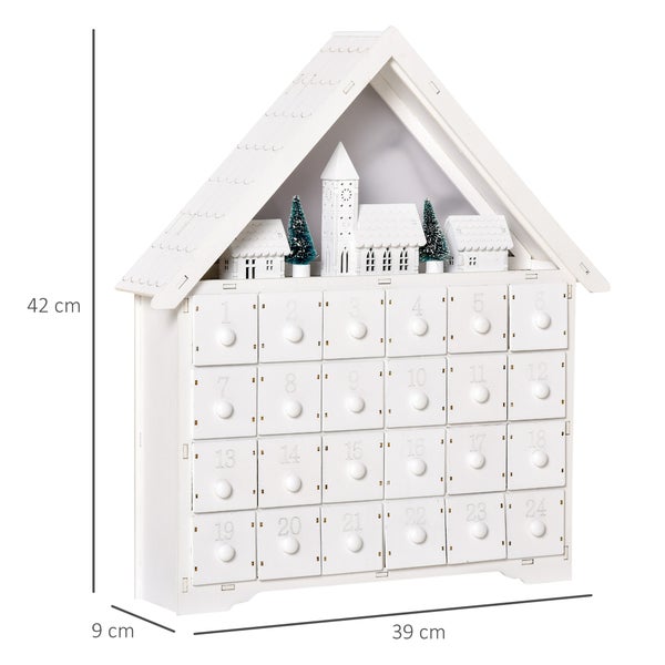 Weißer Holz-Adventskalender, Hausform, 24 Schubladen, Miniatur-Winterdorf, 42 Zentimeter hoch, 39 Zentimeter breit, 9 Zentimeter tief.