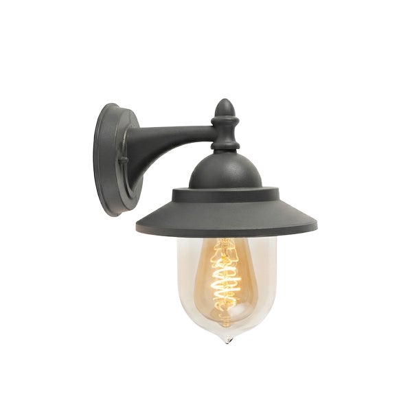 Klassische Außenwandleuchte in Schwarz mit klarem Glasschirm und sichtbarem Filament-Leuchtmittel.