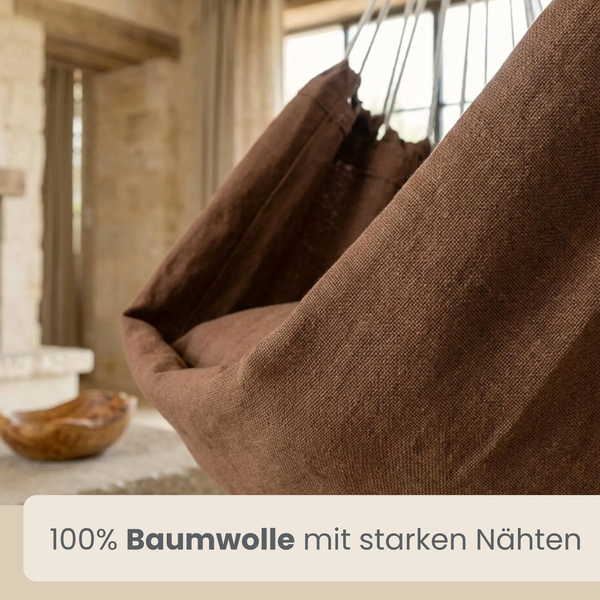 Hängesessel aus 100 Prozent Baumwolle mit stabilen Nähten in einem gemütlichen Wohnbereich mit rustikalem Ambiente