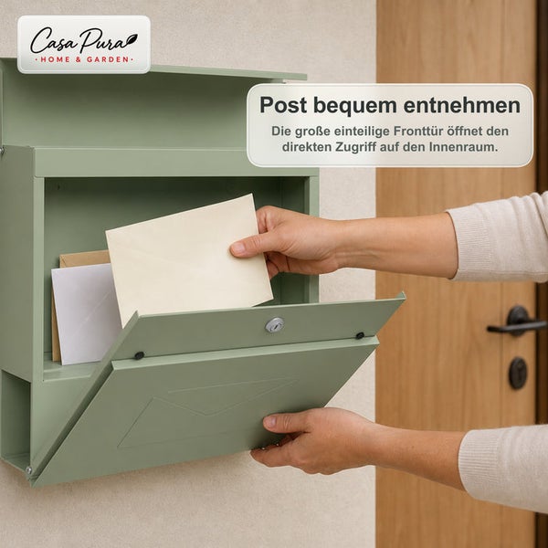 Wandbriefkasten von Casa Pura mit Frontklappe und Briefentnahme durch eine Hand.