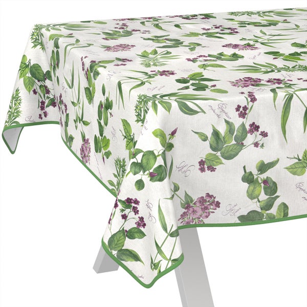 Tischdecke mit botanischem Muster aus Blättern und Blüten mit grünem Saum.