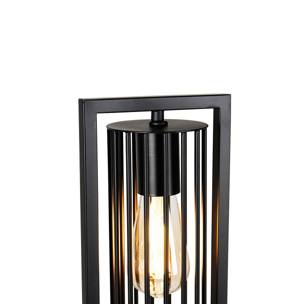 Schwarze Tischleuchte mit Glühbirne in Metallkäfig