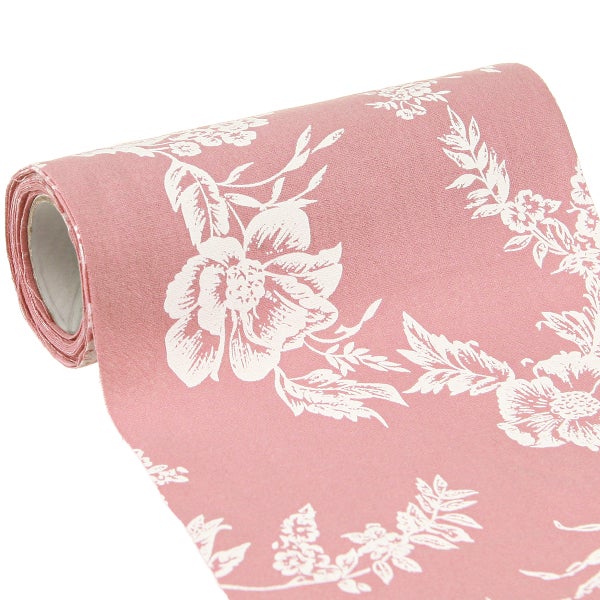 Eine Rolle Vliestapete in Rosa und Weiß mit einem floralen Muster aus großen Blüten und Blättern.