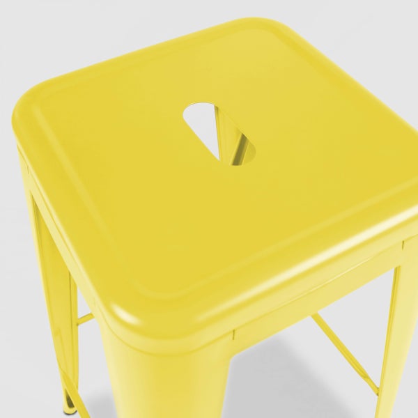 Gelber Metallhocker mit quadratischer Sitzfläche und einem Griffloch in der Mitte.