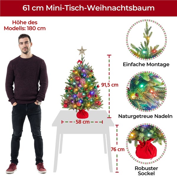 61 Zentimeter Mini Tischweihnachtsbaum auf einem Tisch, mit einer Person zum Größenvergleich
