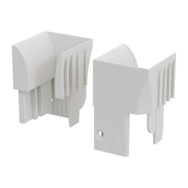 Zwei weiße Eckverbinder für Sockelleisten