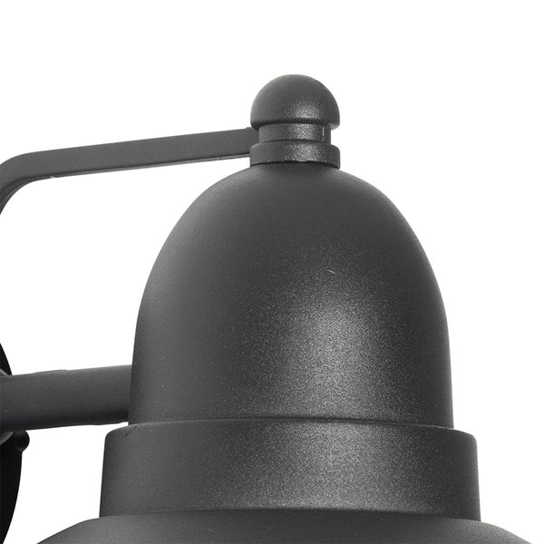 Detailaufnahme einer schwarzen Außenwandleuchte mit strukturierter Oberfläche und glockenförmigem Schirm.