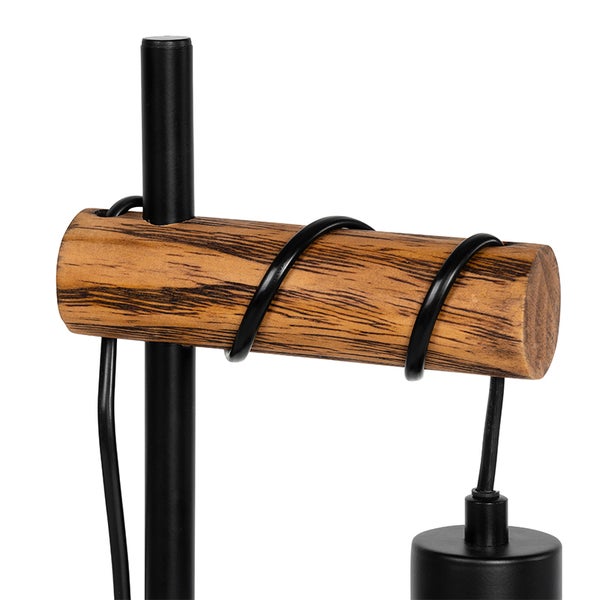 Detailaufnahme einer Lampe mit Holzapplikation und schwarzem Metallgestell