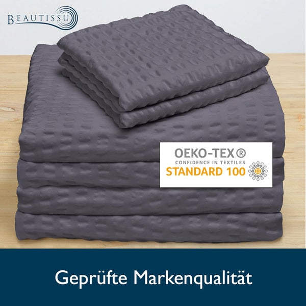 Gefaltete strukturierte Textilien, Beautissu Logo und OEKO-TEX Standard 100 Siegel für schadstoffgeprüfte Textilien. Geprüfte Markenqualität.