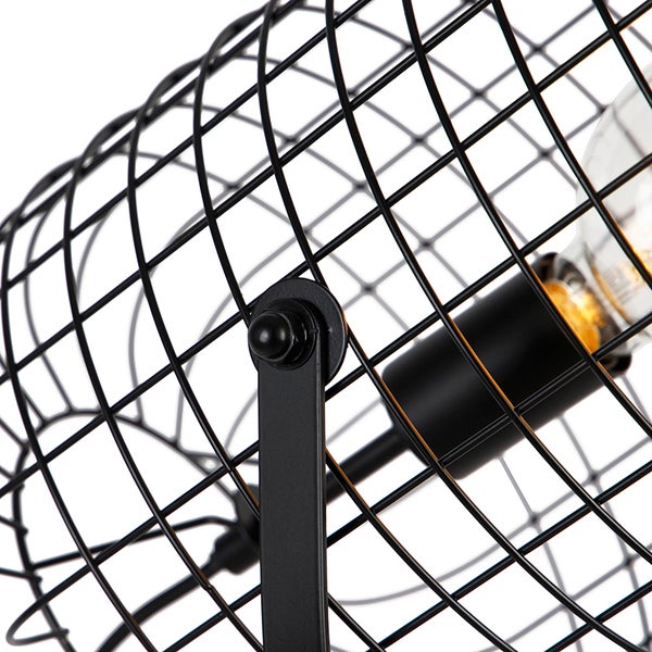 Detailansicht einer schwarzen Drahtlampe mit Leuchtmittel