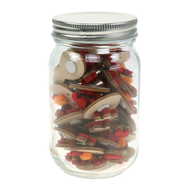 Glas mit hölzernen Weihnachtsschmuckelementen