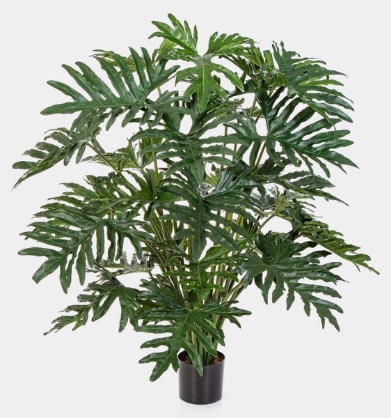 Künstlicher Philodendron Selloum mit großen, grünen, tief geschlitzten Blättern in einem schwarzen Topf.