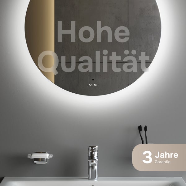 Runder Badezimmerspiegel mit LED-Beleuchtung und AM.PM Logo über einem Waschbecken mit Armatur. Drei Jahre Garantie.