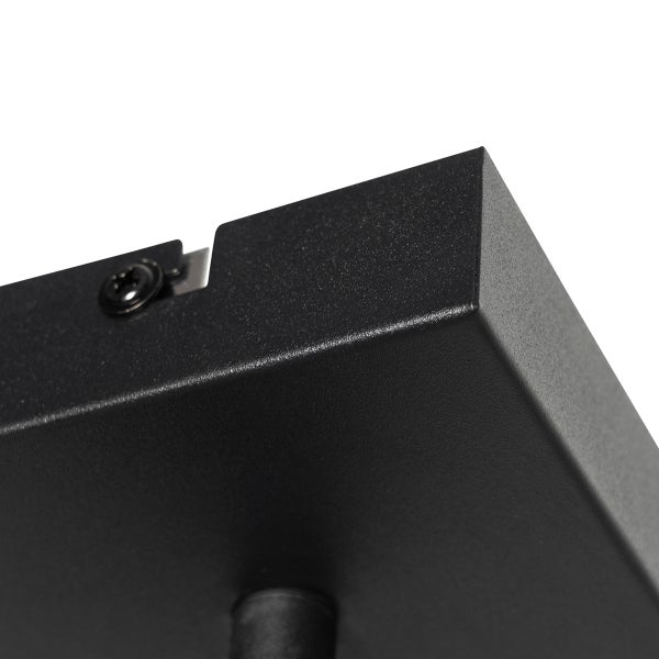 Detailaufnahme einer schwarzen Deckenleuchte mit Schraube