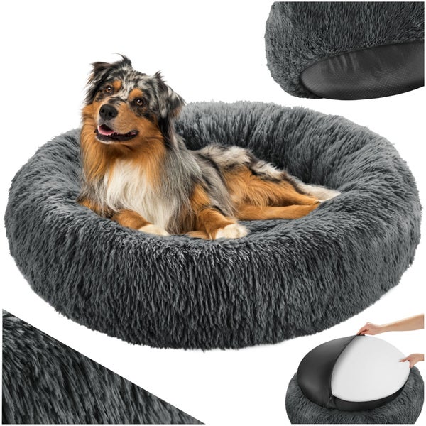 Hund liegt in einem grauen, runden und flauschigen Hundebett