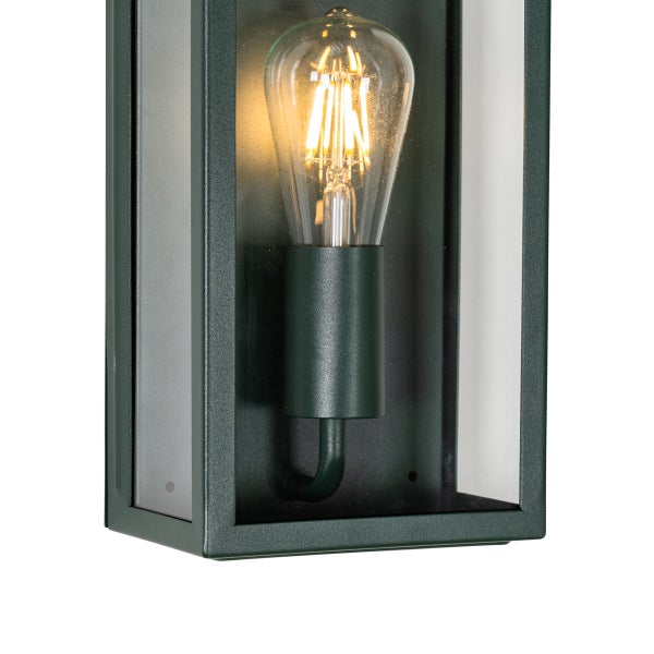 Rechteckige Außenwandleuchte aus dunklem Metall mit Glasfenstern und einem leuchtenden Filament-Leuchtmittel.