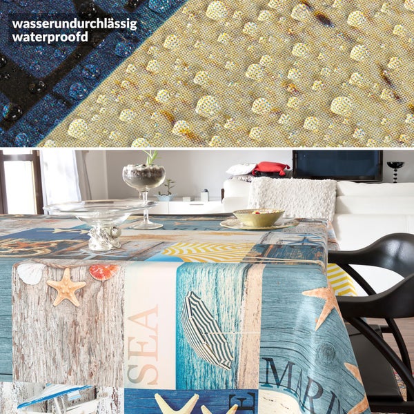 Wasserundurchlässige Tischdecke mit maritimem Motiv auf einem Tisch in einem hellen, modern eingerichteten Esszimmer.