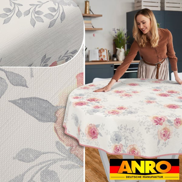 Runder Tisch mit beschichteter Tischdecke mit Rosenmuster und ANRO Logo